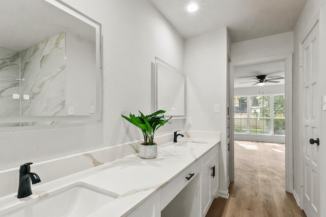 bathroom featuring vanity, wood-type flooring, and ceiling fan