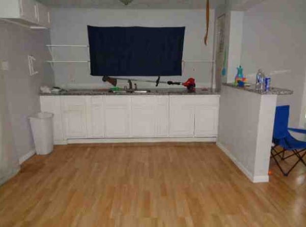 4716 Mierianne St, Houston, TX 77093 - bar featuring baseboards, a sink, and light wood-style floors