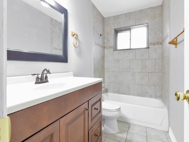 full bathroom with vanity, toilet, tile patterned flooring, and tiled shower / bath