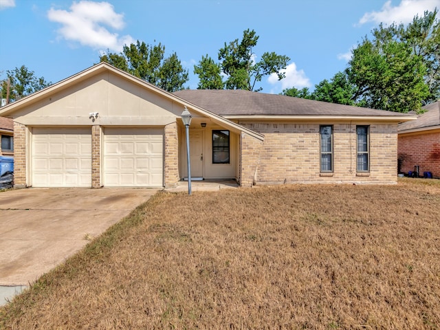 ranch-style home with a front yard and a garage