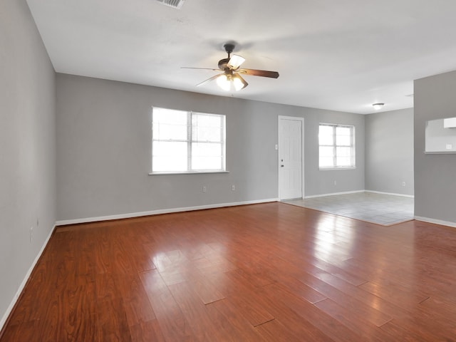 unfurnished room featuring hardwood / wood-style flooring and ceiling fan