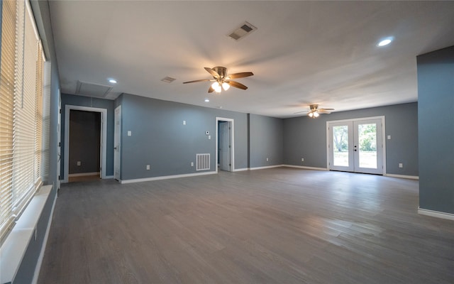 empty room featuring french doors, dark hardwood / wood-style floors, and ceiling fan