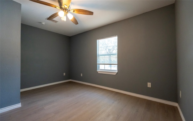 unfurnished room featuring wood-type flooring and ceiling fan