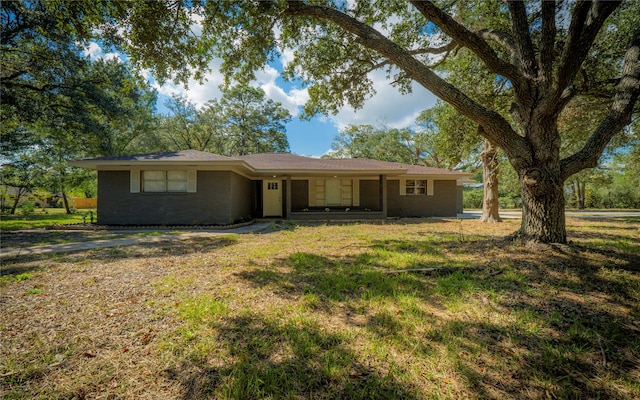 ranch-style home with a front lawn