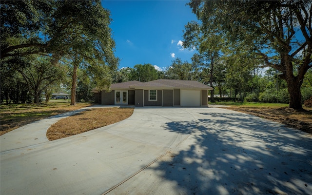 single story home featuring a garage