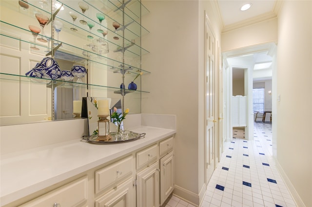 bar with light tile patterned floors and crown molding