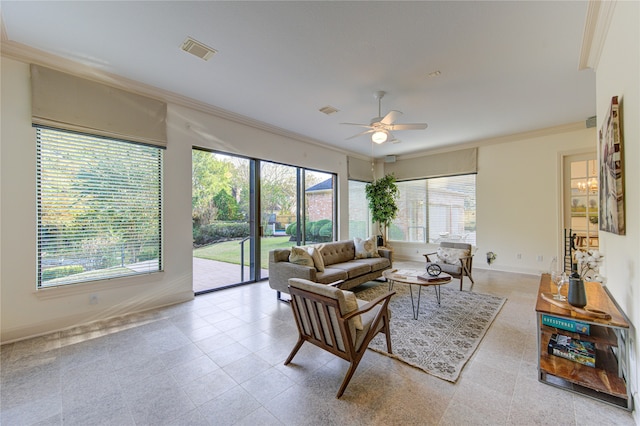 living room featuring ceiling fan and crown molding