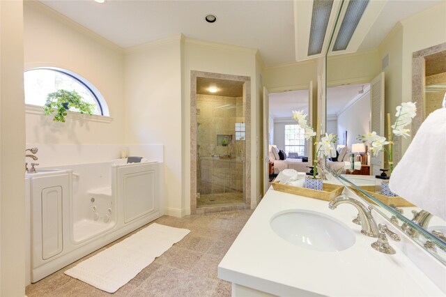 bathroom with vanity, a healthy amount of sunlight, shower with separate bathtub, and ornamental molding