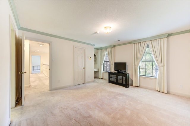 unfurnished living room with light colored carpet, a textured ceiling, and crown molding