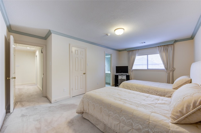 carpeted bedroom with a textured ceiling and crown molding