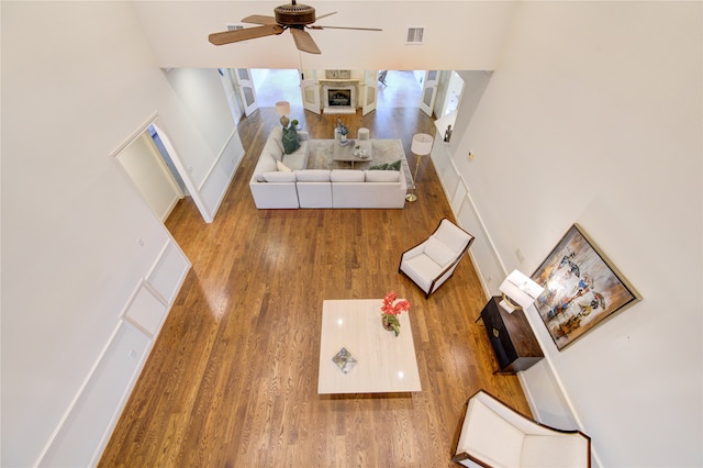 living room featuring ceiling fan and wood-type flooring