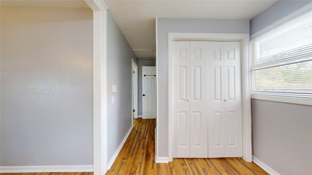 corridor featuring light wood-type flooring