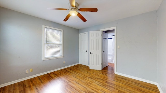 unfurnished bedroom with light hardwood / wood-style flooring and ceiling fan