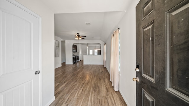 hallway featuring dark hardwood / wood-style flooring