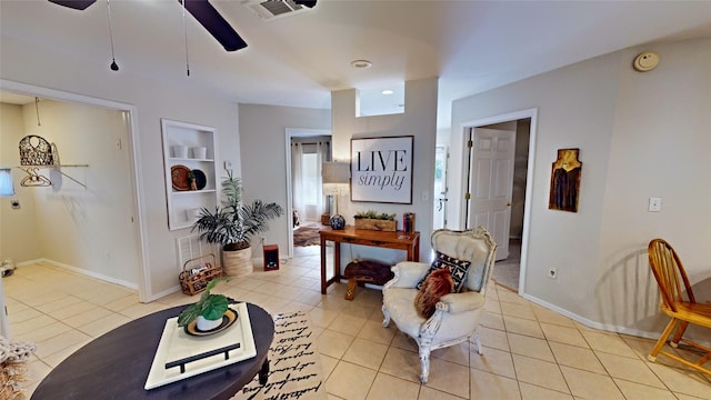 tiled living room featuring built in shelves