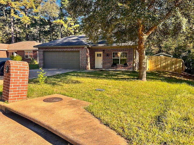 view of front of home with a front yard and a garage