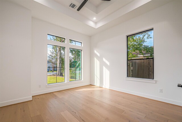 spare room featuring ceiling fan, light wood finished floors, recessed lighting, baseboards, and visible vents