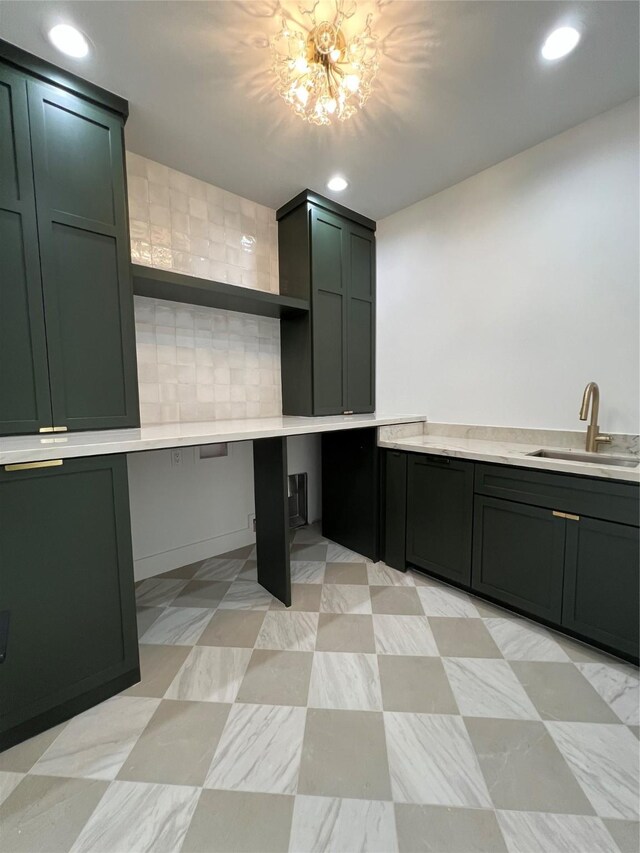 kitchen with light countertops, recessed lighting, open shelves, and a sink