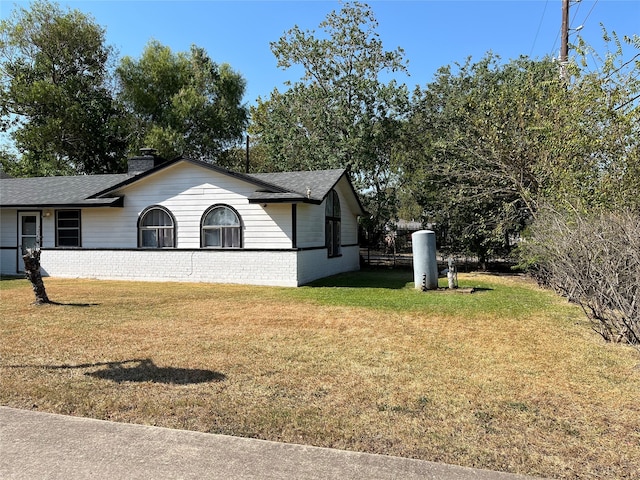 view of home's exterior featuring a lawn