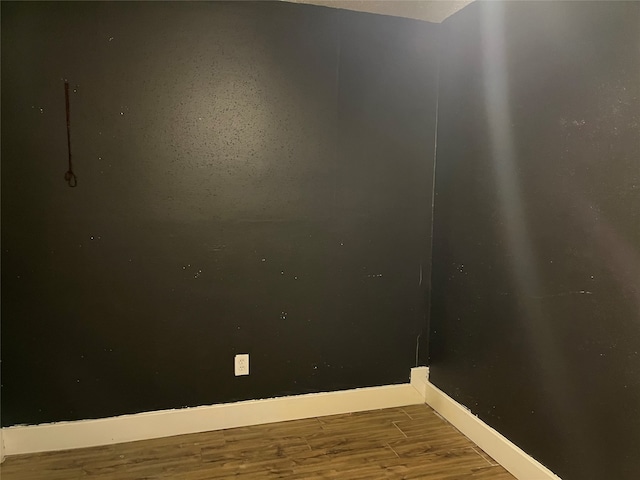 spare room featuring dark hardwood / wood-style floors