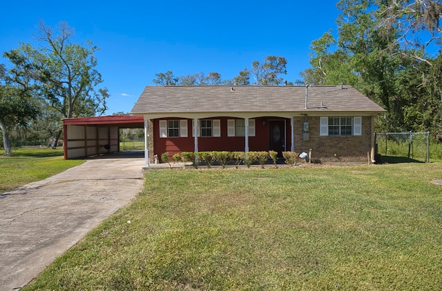 view of front facade featuring a front lawn and a carport