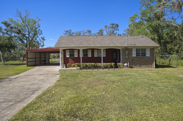 6823 County Road 659, Brazoria, TX 77422 - single story home with a front lawn, an attached carport, and driveway
