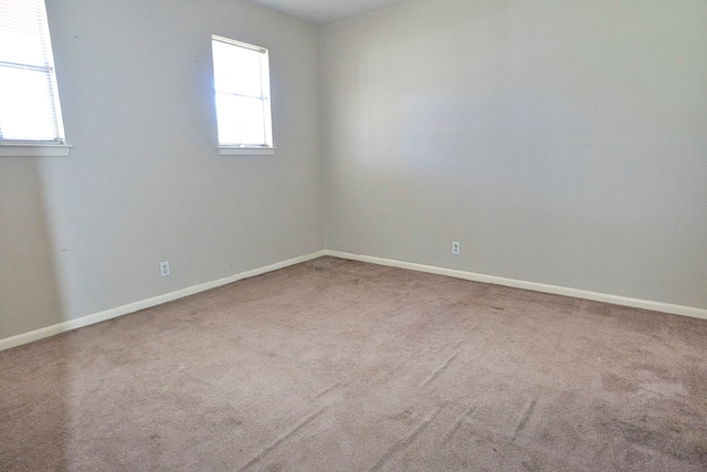 empty room with carpet flooring