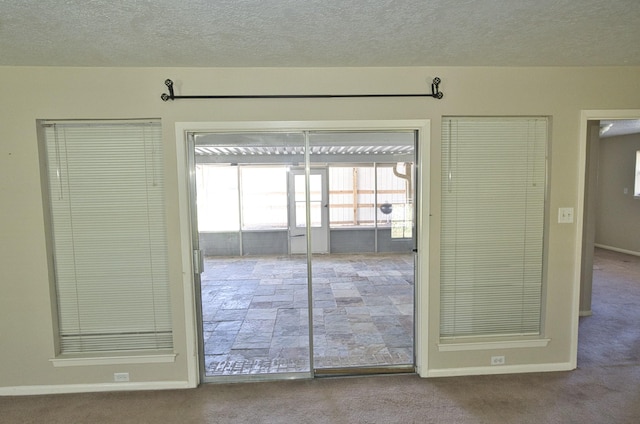 6823 County Road 659, Brazoria, TX 77422 - carpeted empty room with a textured ceiling