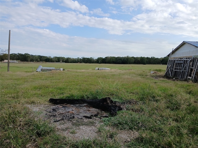 view of yard with a rural view