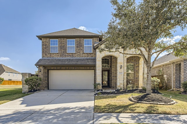 view of front of house with a front yard and a garage