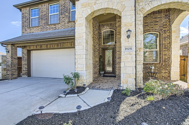 doorway to property featuring a garage