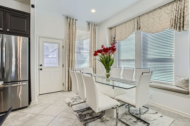 dining space with a healthy amount of sunlight and light tile patterned floors