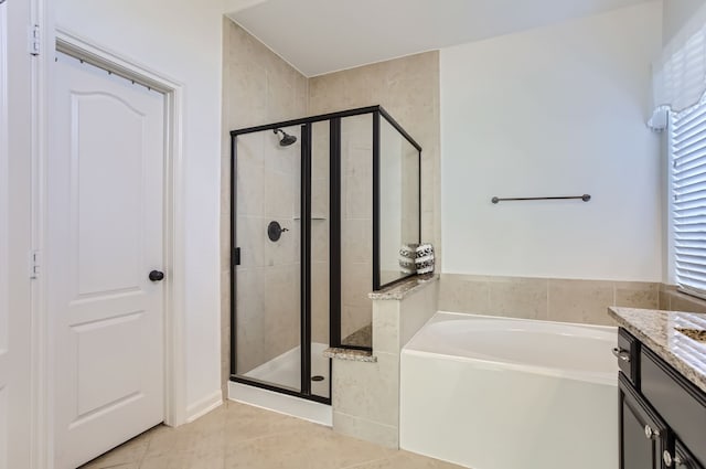 bathroom with vanity, shower with separate bathtub, and tile patterned flooring