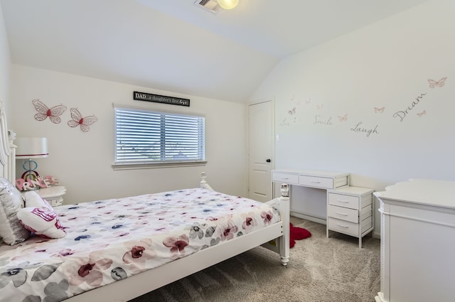 bedroom with lofted ceiling and carpet floors