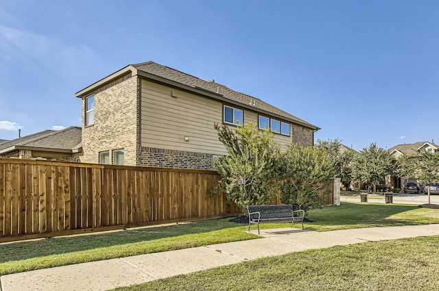 view of home's exterior featuring a lawn