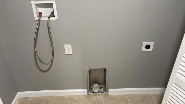 laundry area with hookup for a washing machine, hookup for an electric dryer, and tile patterned flooring