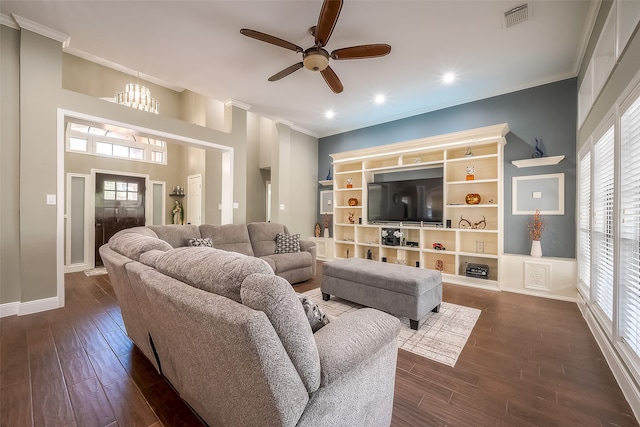 living room featuring ornamental molding, dark wood-type flooring, and ceiling fan