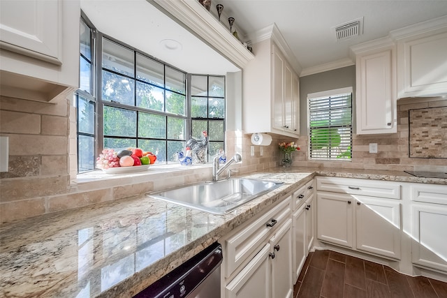 kitchen featuring white cabinetry, tasteful backsplash, sink, and plenty of natural light