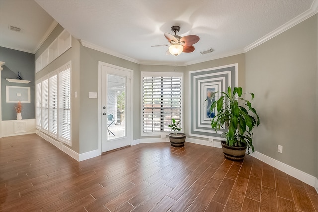 doorway with a wealth of natural light, ceiling fan, and dark hardwood / wood-style flooring