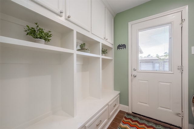 mudroom featuring dark tile patterned flooring