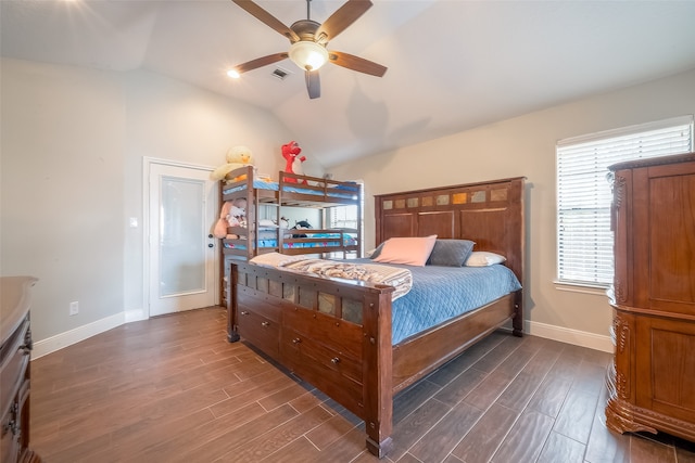 bedroom featuring dark hardwood / wood-style floors, ceiling fan, and vaulted ceiling