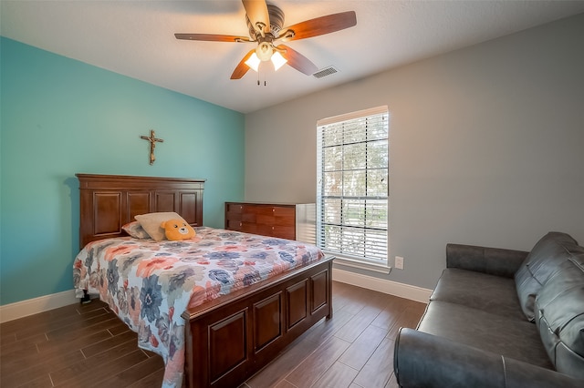 bedroom featuring dark wood-type flooring and ceiling fan