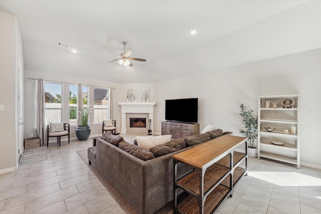 living room featuring ceiling fan and light tile patterned floors