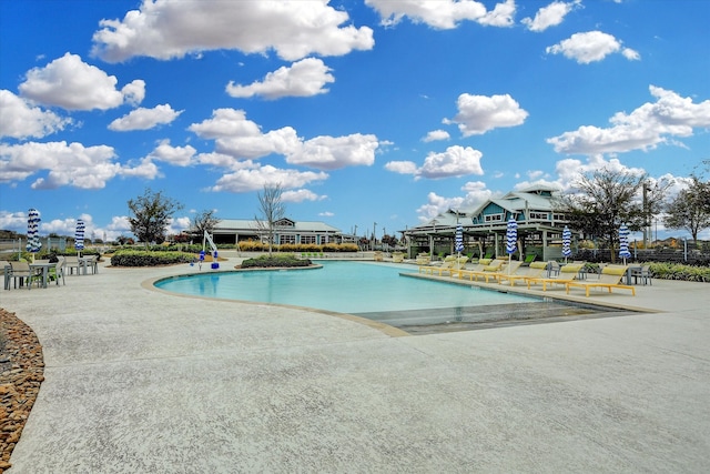 view of pool featuring a patio