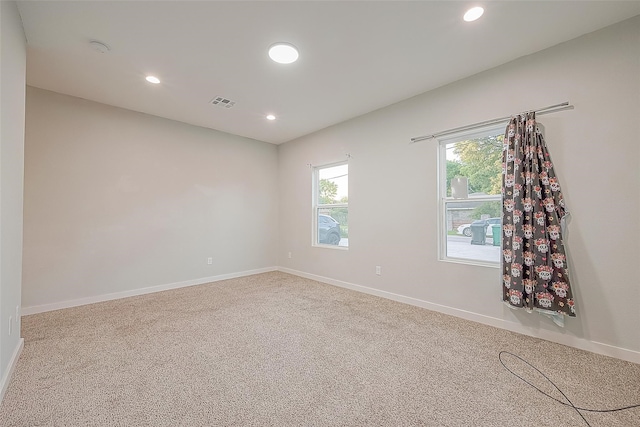 unfurnished room with carpet floors