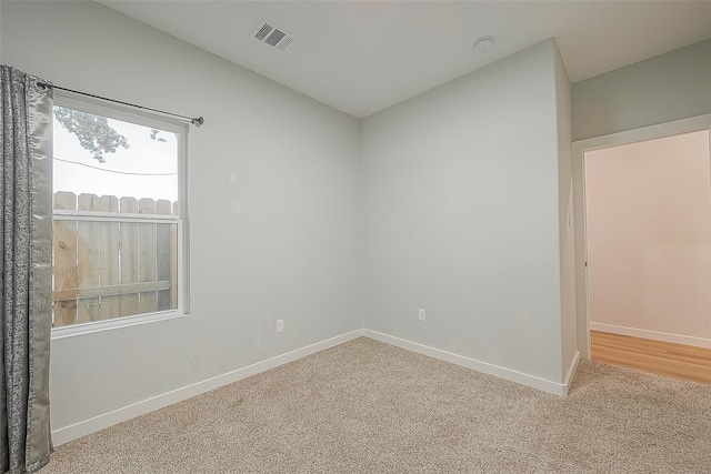 unfurnished room featuring carpet flooring