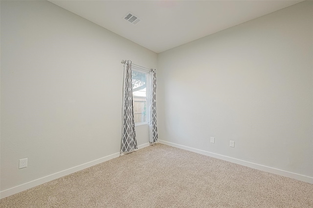 unfurnished room featuring carpet