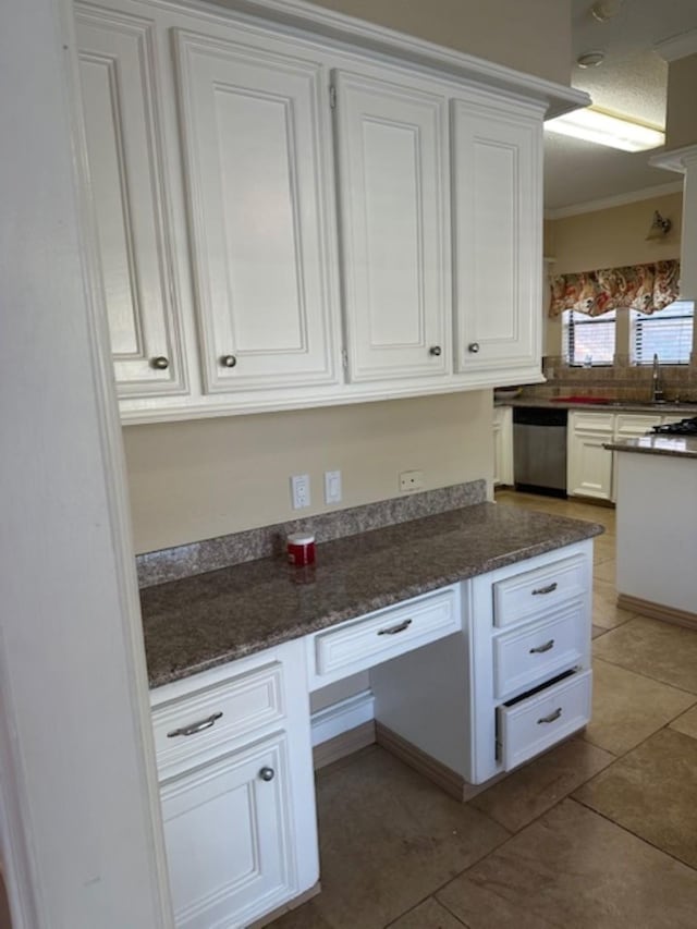 kitchen with white cabinets, light tile patterned flooring, ornamental molding, and dishwasher