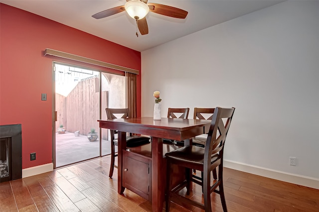 dining room featuring hardwood / wood-style floors and ceiling fan