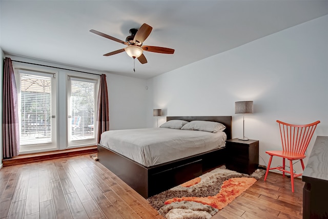 bedroom featuring light wood-type flooring and ceiling fan